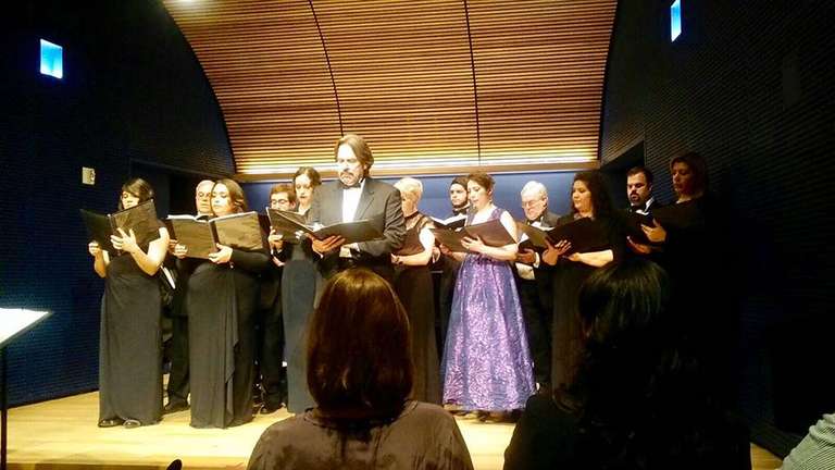 Jamie with other choristers and soloists, performing at the National Opera Center.